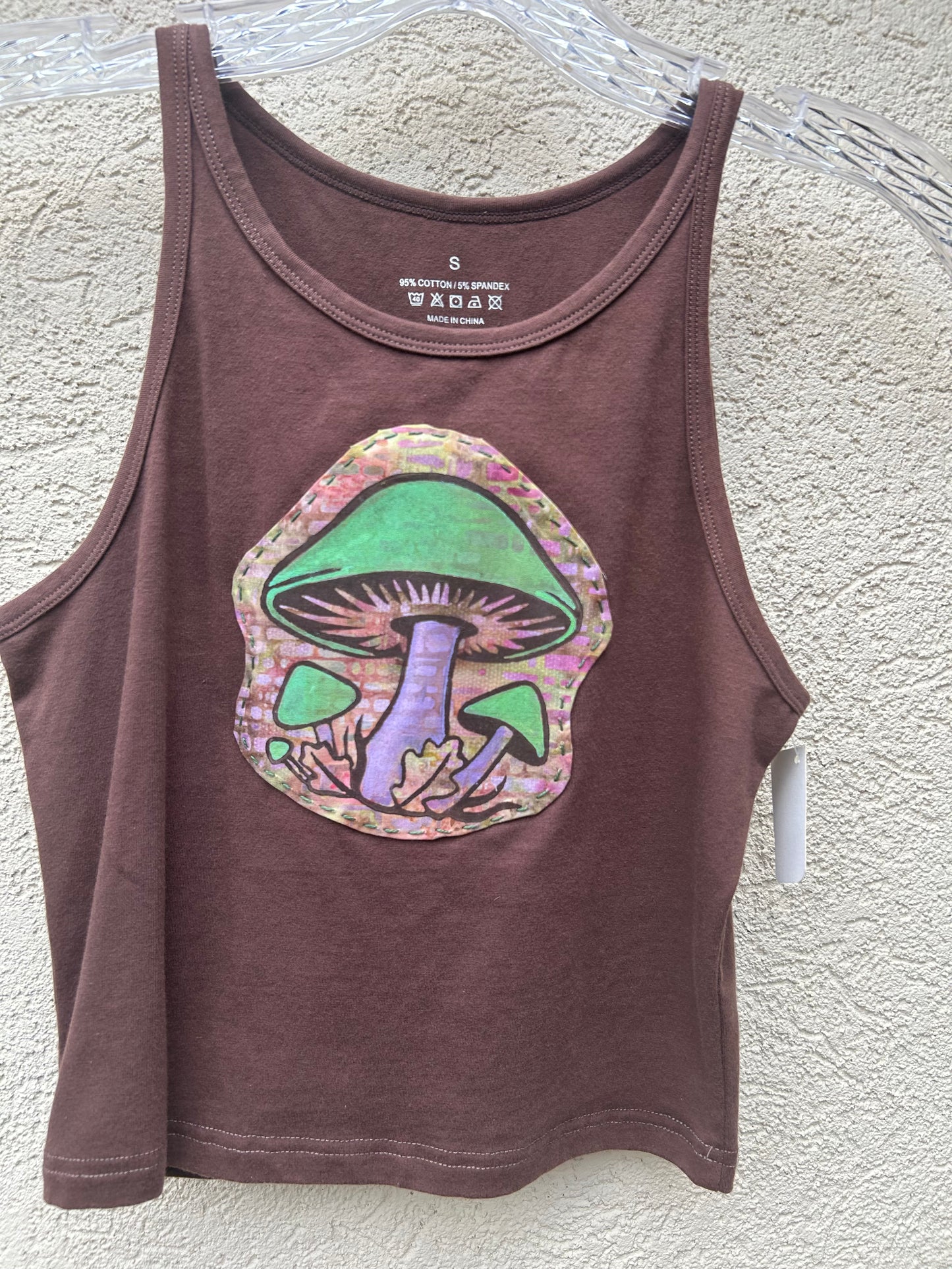 crop tank top with browns greens and purples hand stamped embroidered on mushrooms